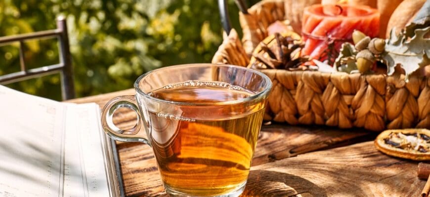 Cozy,Warm,Autumn,Composition,With,Cup,Of,Hot,Tea,,Burning