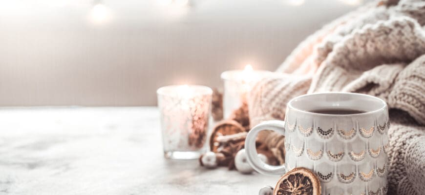 Cozy,Winter,Composition,With,A,Cup,And,Sweater,On,A